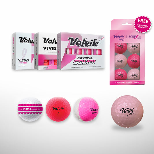 Volvik brand BCRF golf balls and packaging on a light gray background, including boxed Volvik VISTA3 and Crystal Combi balls, a pink Volvik BCRF Unity 6 ball pack with a free badge, and four loose golf balls in white, pink, and translucent pink.