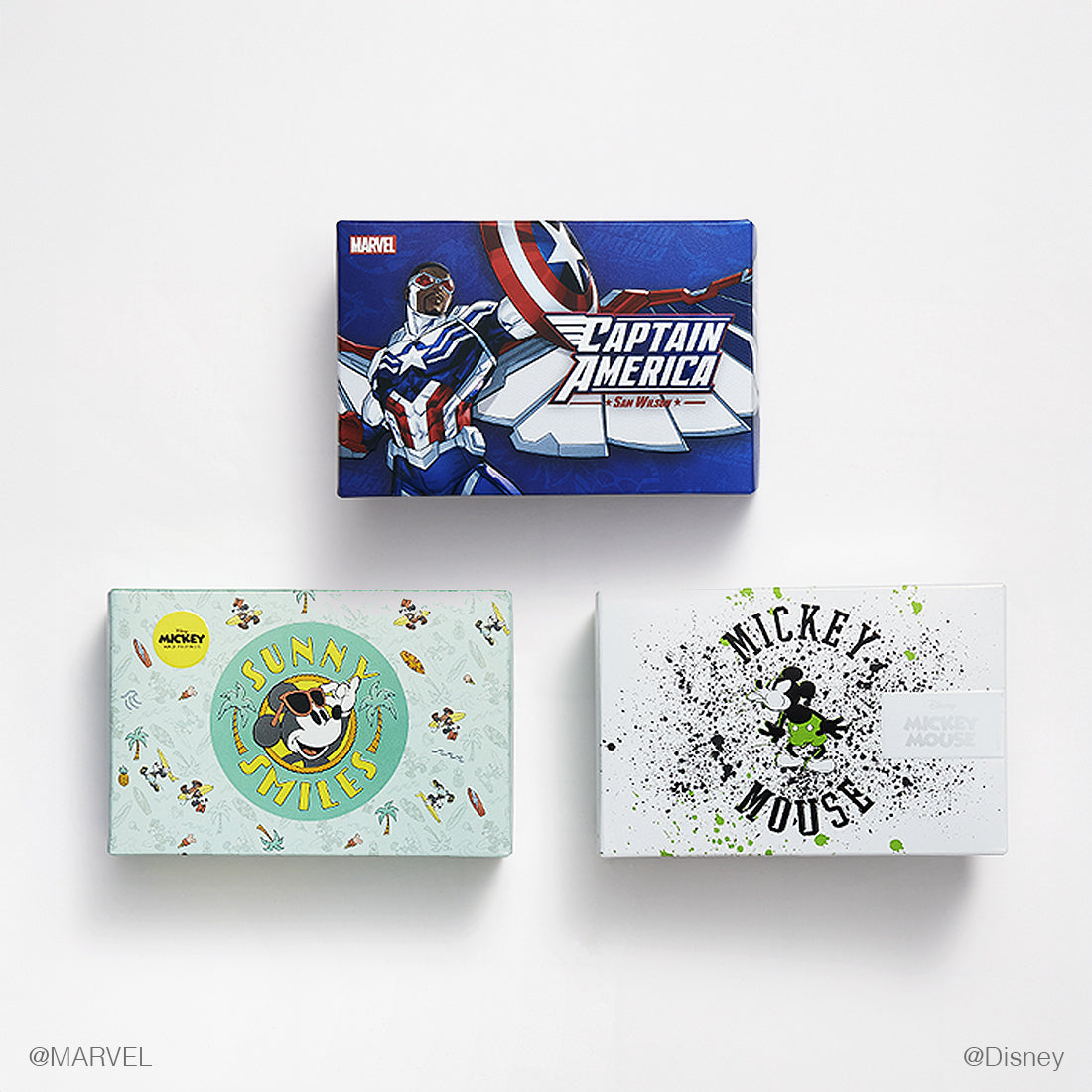 Three themed golf ball boxes featuring Marvel and Disney characters on a white background