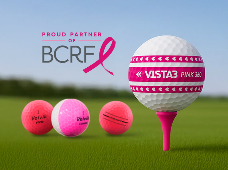Golf balls and a golf ball on a tee with Vista3 branding, set against a clear sky with logo Proud Partner of BCRF