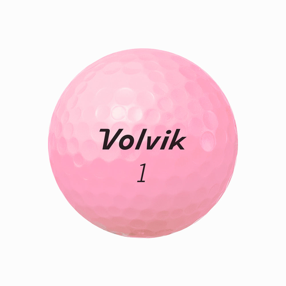 Pink golf ball with 'Volvik' branding on a white background