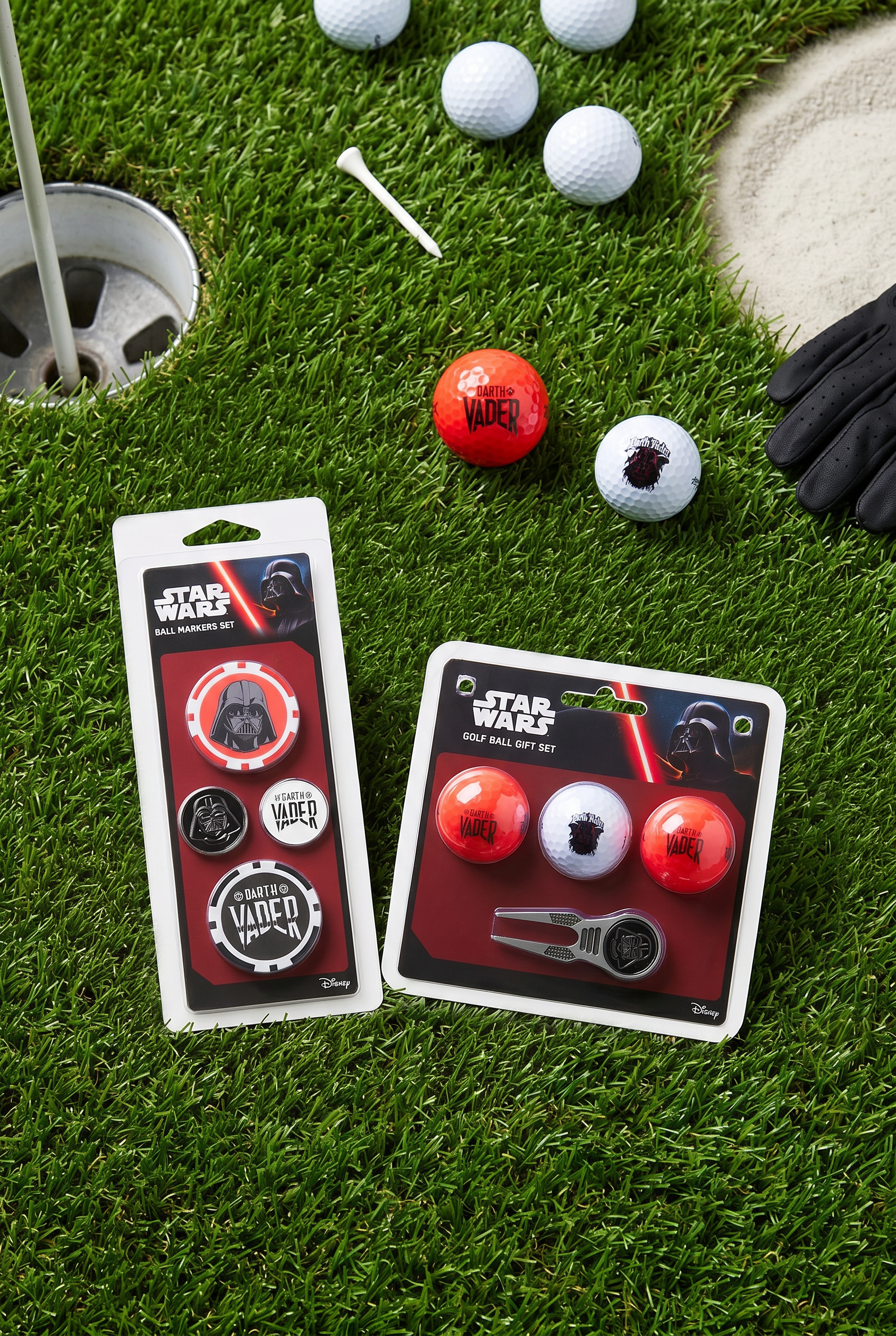 Star Wars-themed golf balls and packaging on a grassy background