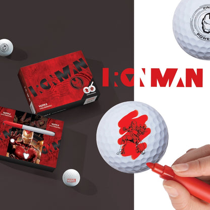A collection of golf balls with Iron Man designs, a box of golf balls, and a magic marker pen.